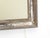 This 19th Century silverleaf mirror has an old patina with bright silver and pewter tones and measures 25.75"H x 21.5"W.
