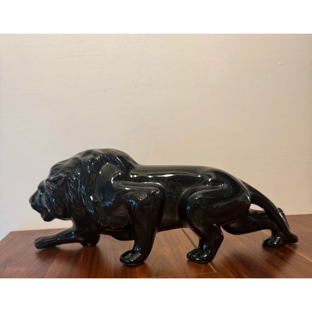 This Mid-Century Porcelain Lion Sculpture looks beautiful wherever you may choose to display. It’s in perfect condition...