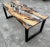 Studio is a dining table made of wood and epoxy resin. In this River Table two steps of Lecce olive and epoxy resin are...