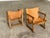 A rare and exceptionally characterful pair of Spanish mid-century lounge chairs in original saddle leather and solid wood...