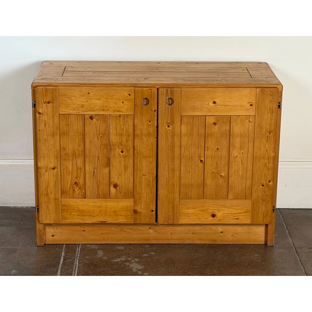 1960's solid pine cabinet by the iconic Charlotte Perriand for Les Arcs. Good vintage condition. Nice patina all around....