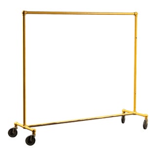Vintage Industrial Pipe Rolling Garment Rack in Yellow For Sale