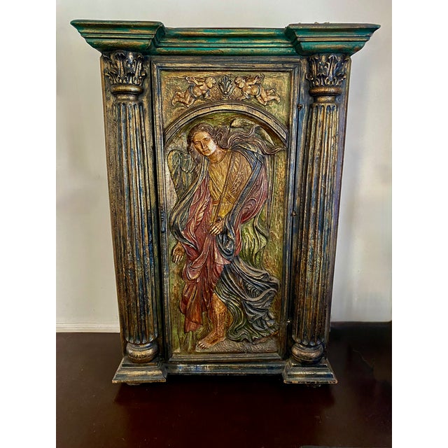This exceptional antique Spanish armoire is a striking example of Renaissance Revival craftsmanship, richly detailed with...