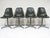 This set of side chairs by Charles and Ray Eames are post-war classics. The seats are elephant hide gray fiberglass with...