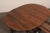 A Swedish fir wood double drop leaf and gate-leg table table from the 18th century. This antique oval-shaped table from...