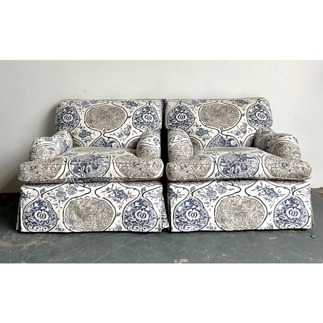 This exquisite pair of vintage lounge chairs captures the quintessential elegance of Hollywood Regency style, updated with...