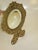This product is a beveled glass mirror with a gold gilt metal frame. Victorian for use on a table or wall. The mirror is...