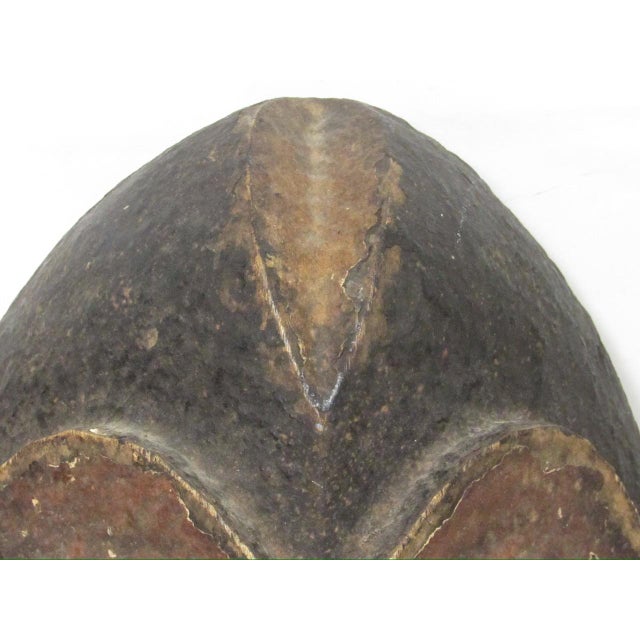 Vintage West African mask from the Ivory Coast, c.1930’s Roughly elongated oval in shape with large stylized goggle-shaped...