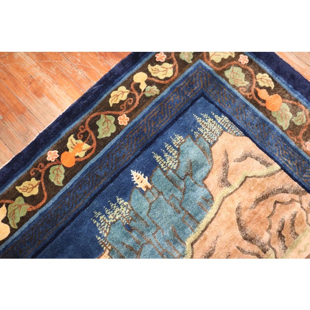 An early 20th Century Chinese gallery-size rug with a landscaping scenic pictorial motif. Measures: 6' x 12'3''