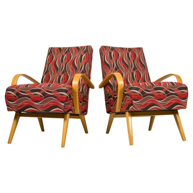 A striking pair of mid-century modern armchairs designed by Jaroslav Šmídek in Czechoslovakia during the 1960s. These...