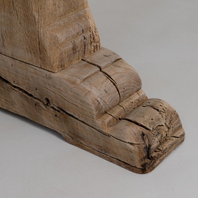 This 20th Century French oak trestle dining table showcases timeless craftsmanship and a bold, rustic presence. The thick,...