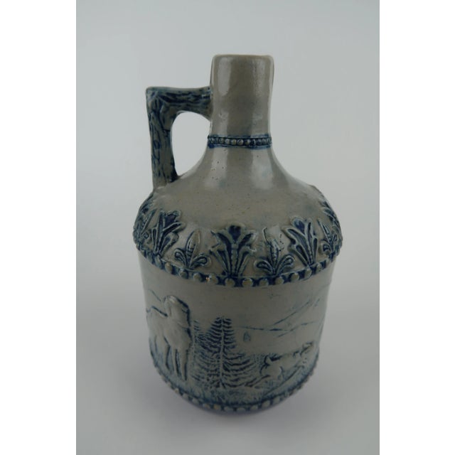 are and hard to find blue and grey artful Utica stoneware jug by the nineteenth century Whites Pottery of Utica, New York....