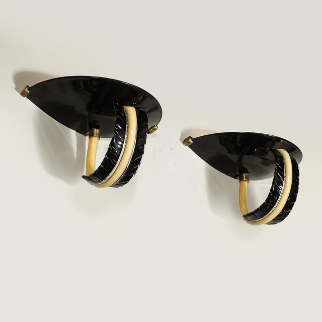 A timeless and Rare pair of Mid-Century Modernist hand-blown Murano glass sconces by Seguso Elements, crafted in Italy...