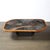 This bold and materially unique Mid-Century Modernist Tessellated Slate and Bronze Inlay Cocktail Table signed V Ramburrem...