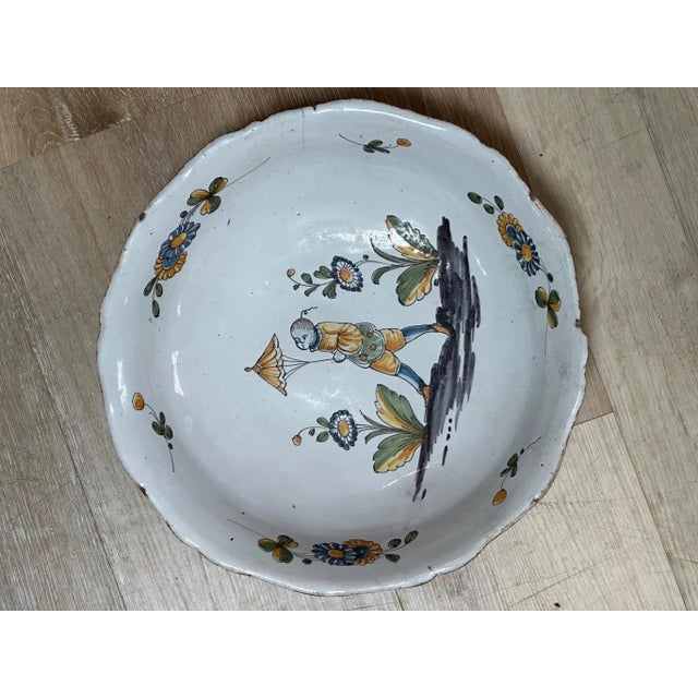 18th century Continental, most likely French, Faience Earthenware Serving Bowl with fluted sides; hand painted vignette of...