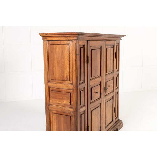 18th century italian walnut cabinet an 18th century italian walnut cabinet. this cabinet is panelled throughout with two...