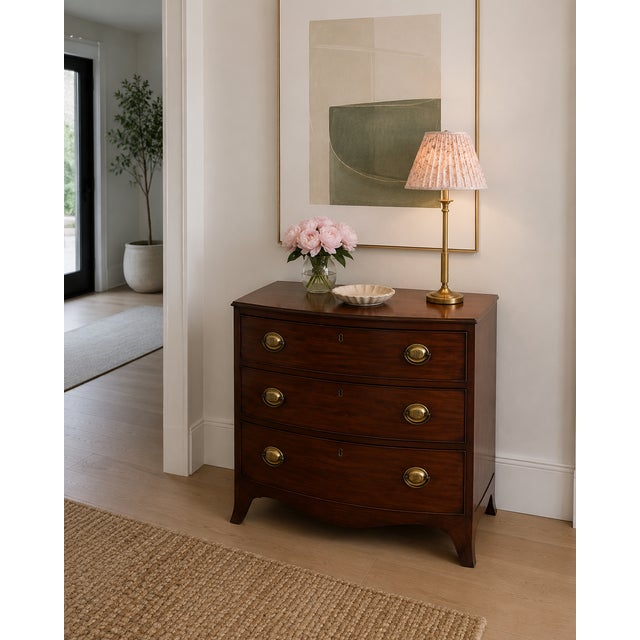 A beautiful antique Georgian quality mahogany bow front chest of drawers dating from 1800, boasting elegant proportions...