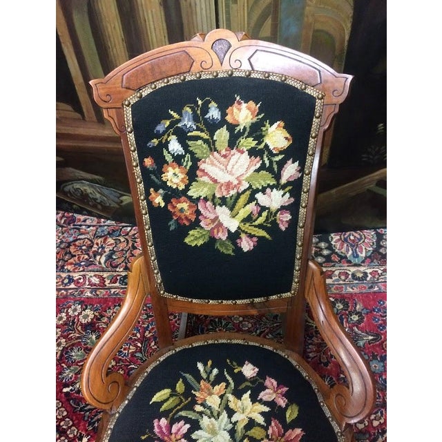 Item: Antique Walnut Rocking Chair with Needlework Seat and Back. Age & Condition: Circa 1880. Good, small chip in the...