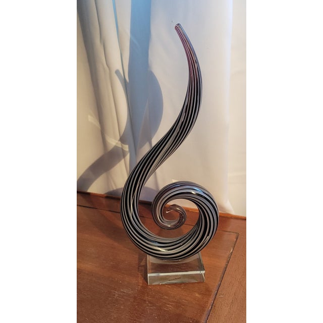 Add a striking sculptural accent to your collection with this **Vintage Murano Style Glass Swirl Sculpture**. Featuring an...