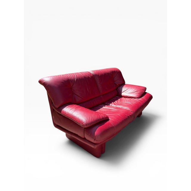 Iconic postmodern red leather 2 seat sofa with a lived in charming vintage look. These are probably Natuzzi version of the...