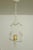 1950s White painted Metal Pendant with organic details from Sweden. One candle shaped light source with a frame with...