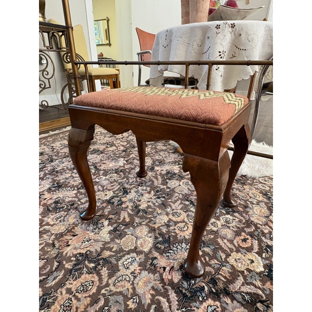 Queen Anne style Mahogany footstool/bench. Beautiful cabriole legs paired with salmon colored upholstery with zigzag...