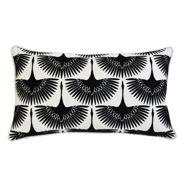 A custom-tailored pillow in designer Genevieve Gorder's onyx flock cotton duck fabric depicts a flocked velvet abstract...