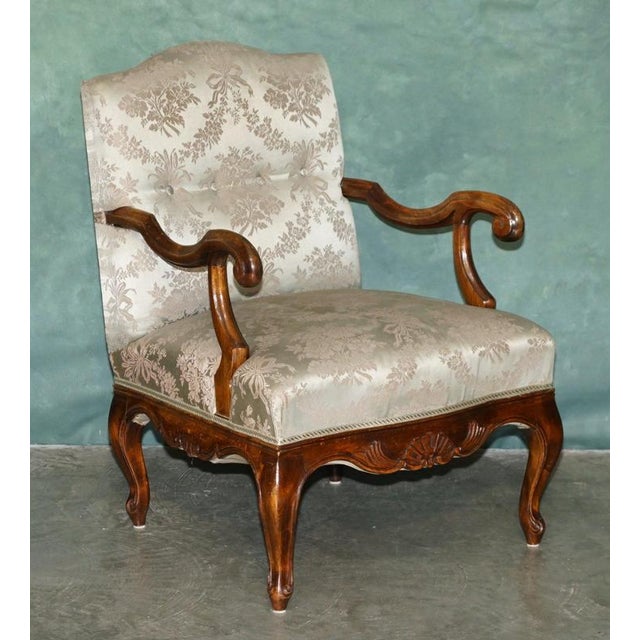 Elegant pair of antique French walnut armchairs, dating to Circa 1880 to 1900 Displaying the graceful curves associated...