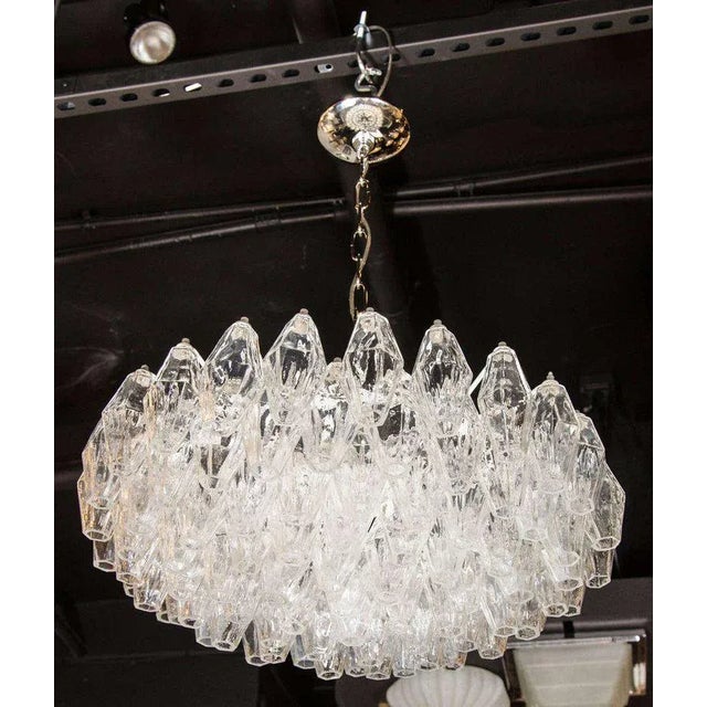 This luminous modernist glass chandelier features numerous handblown Murano translucent glass polyhedral shades. Each...