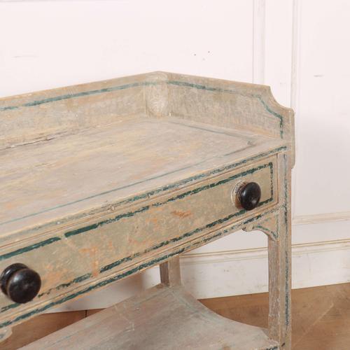 Interesting 19th Century English original painted two tier side table. 1820s. Height to the worktop - 74cm This piece is...