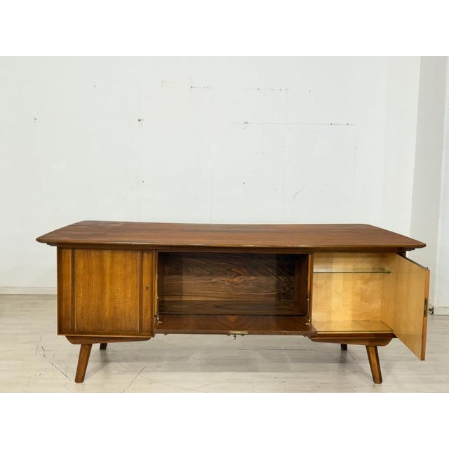 For sale is a high-quality vintage desk from the 1960s in excellent condition. As a freestanding piece, it is a real eye-...
