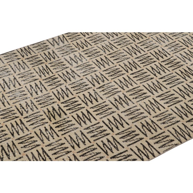 Made with hand-knotted wool circa 1960-1970, this 4x6 vintage rug from Turkey is believed to be the work of mid-century...