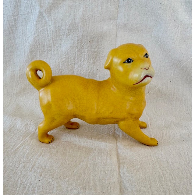 A pair of adorable porcelain pugs from The East India , 19th century. Charming in there demeanor with absolutely the...