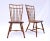 A pair of Nichols & Stone Birdcage Windsor dining chairs featuring split wedge mortise and tenon joinery with faux bamboo...