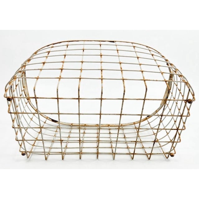 Bring authentic rustic character and functional storage to your home with this vintage mid-century wire utility gathering...