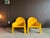 Pair of iconic model 4794 lounge chairs designed by Gae Aulenti, in bright yellow, and manufactured by Kartell/Italy, in...