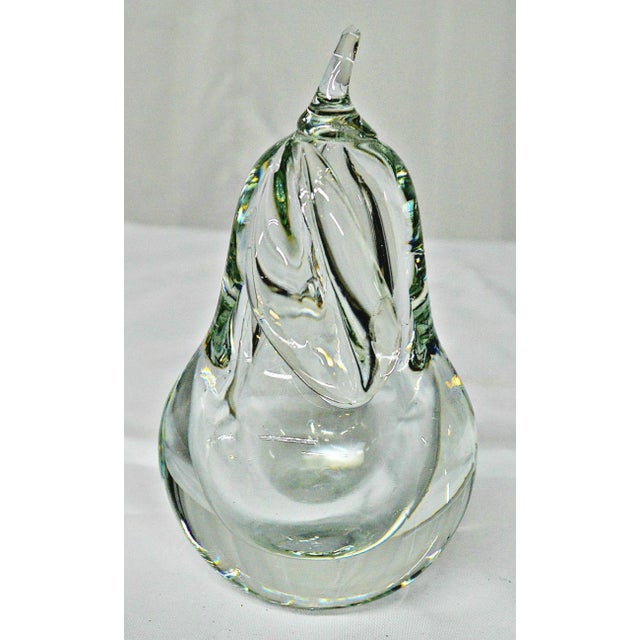 Heavy hand-blown art clear glass pear paperweight. The stem and leaf come out at the top. Although it is clear, as a glass...