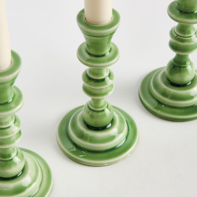 Traditional style in a contemporary fabrication, this set of taper holders is designerinspired. Made of enamel coated...