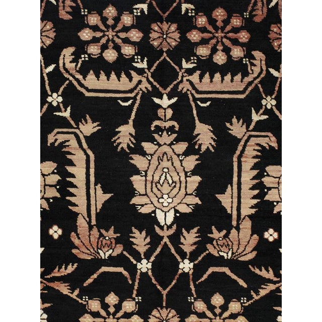 A vintage Indian Cotton Agra carpet. Most cotton Agras from northern India are softly toned, but this unusual example has...