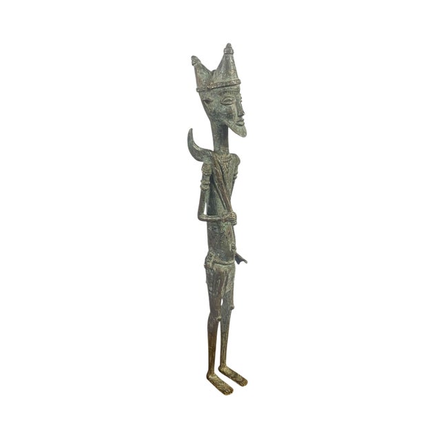 A distinguished Dogon bronze from Mali, this standing male figure exemplifies the refined sculptural traditions of West...