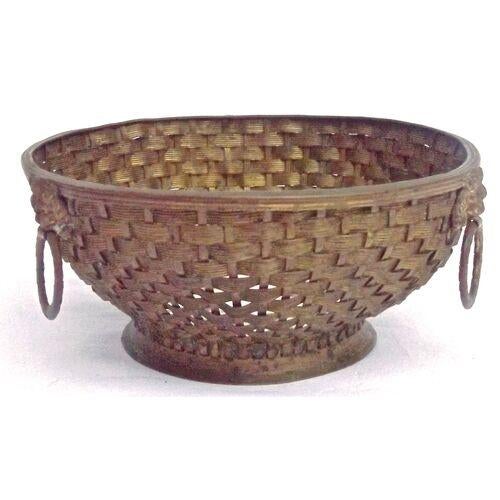 Antique woven brass basket with hand-painted floral porcelain base and lion's head handles. No maker's mark.