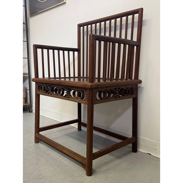 This Antique Chinese Chair features wood wood carved detailing , matted wood, and walnut tone. The aging of the wood is...