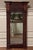 Handsome carved walnut federal mirror. Crotch walnut veneer panel below stately stacked cornice. Beautifully carved...