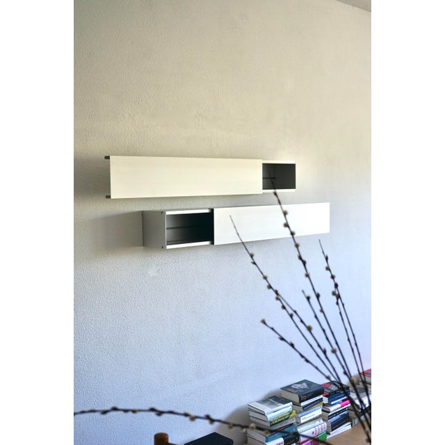 A set of two finely engineered A-Line 'Horizontals' made from anodised aluminium. They each have softly sliding doors that...
