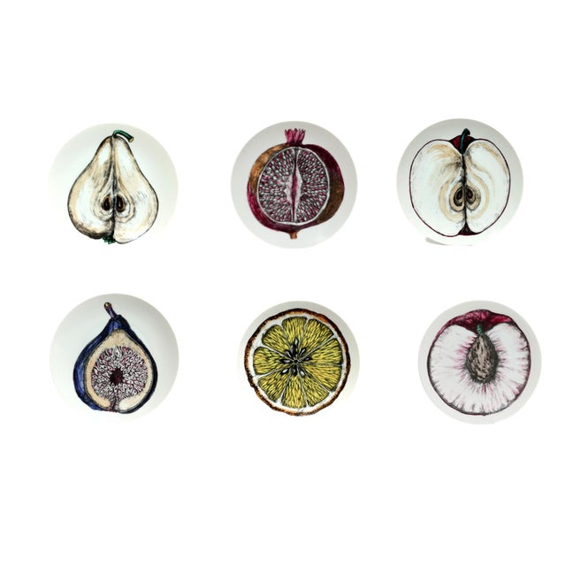 Nature Dissected: Set of Six Fornasetti "Sezioni Di Frutta" Plates Circa 1960s A striking set of six porcelain salad...