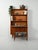 Scandinavian teak bookcase from the 1960s by Hugo Troeds: base with hinged doors, open shelves, pull-out writing desk, and...