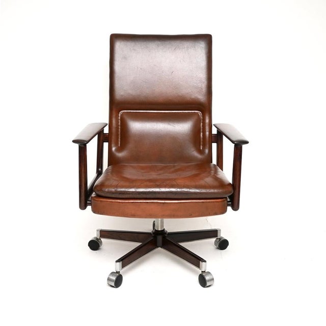 An exceptional Danish vintage leather desk chair by Arne Vodder. It was made in Denmark by Sibast, it dates from around...