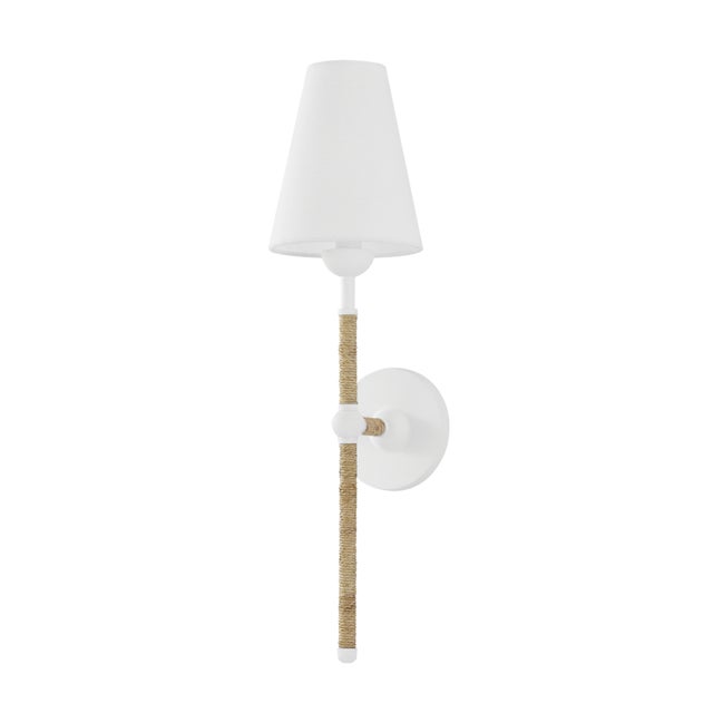The definition of modern coastal style, Mariana features a rattan-wrapped textured white frame and crisp white linen...