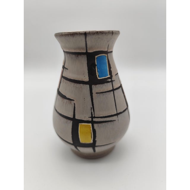 This striking vintage art ceramic vase was produced in the early 1960s by the renowned German manufacturer Bay Keramik in...