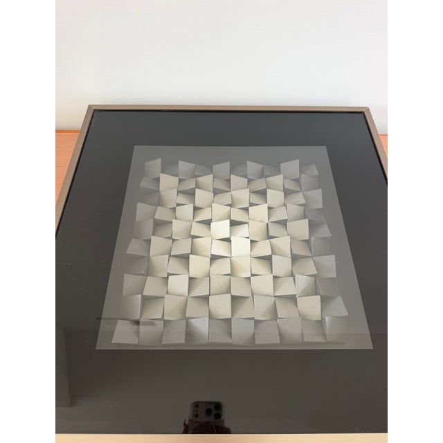 Striking three-dimensional geometric artwork by Brazilian artist Cícero Silva, presented in a sophisticated monochromatic...